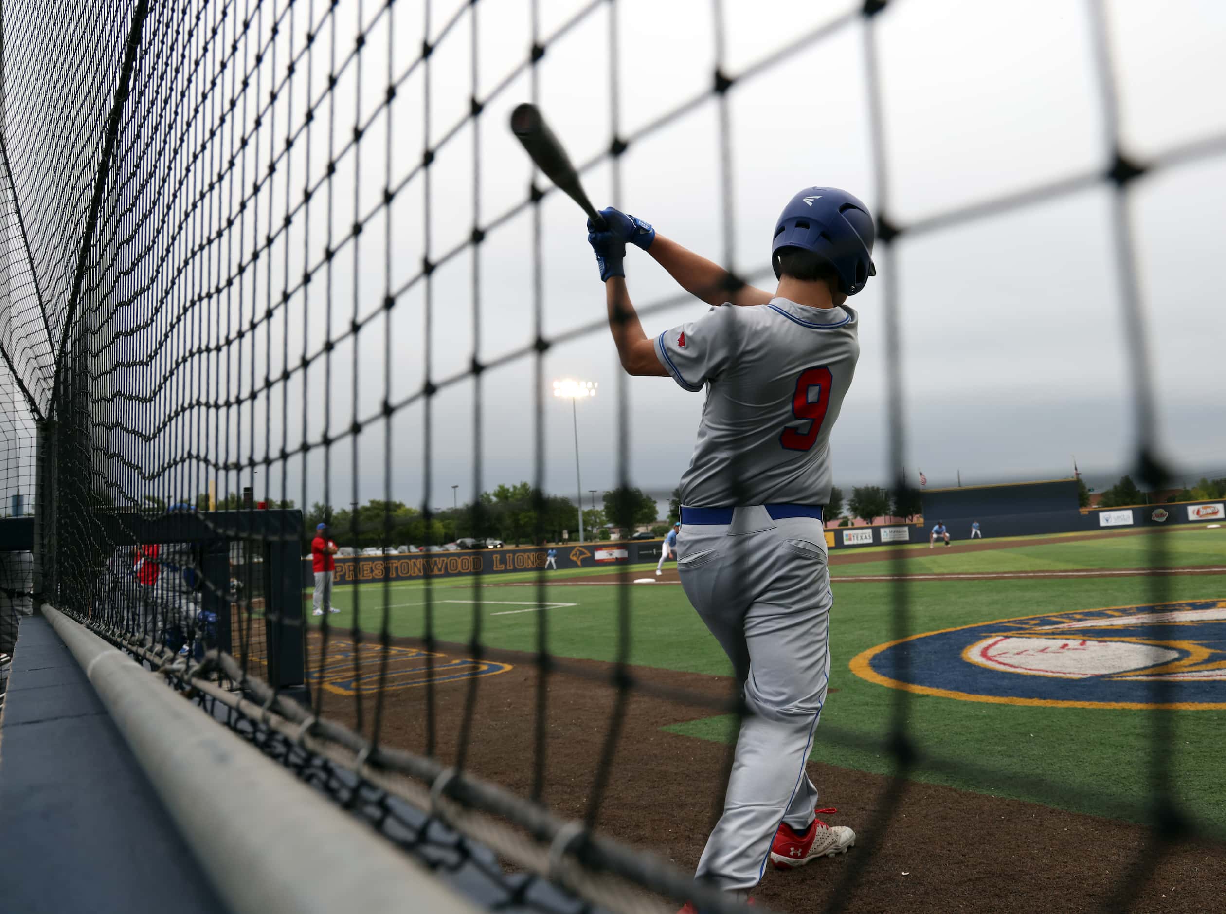 Parish Episcopal outfielder Jacob Hoffman (9) warms up in the on-deck circle during the top...