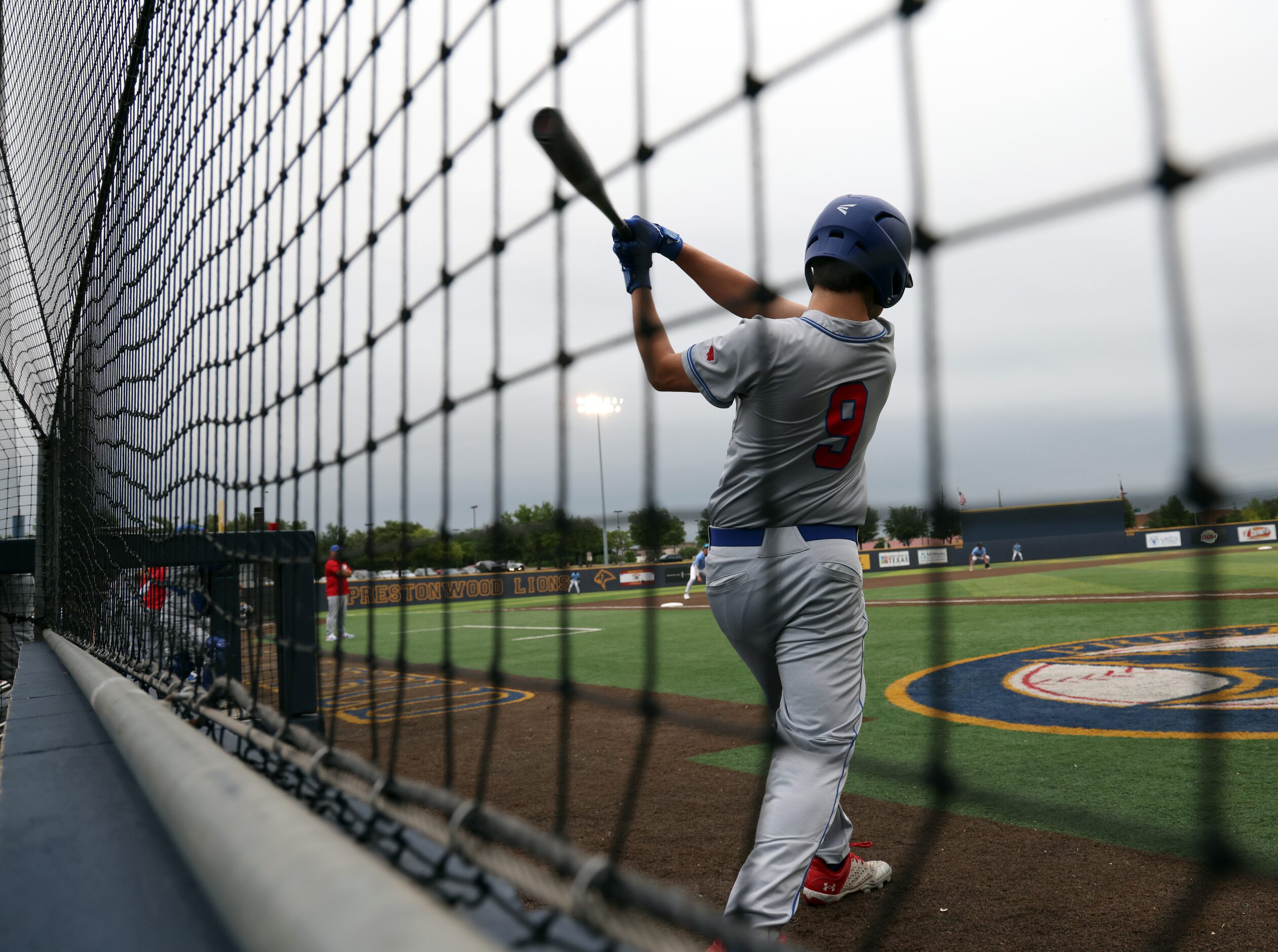 Parish Episcopal outfielder Jacob Hoffman (9) warms up in the on-deck circle during the top...