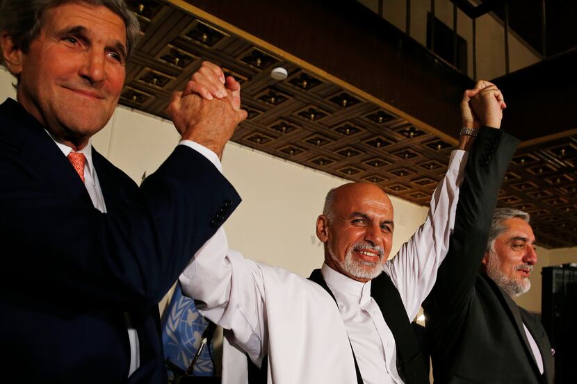 U.S. Secretary of State John Kerry, left, and Afghanistan's presidential candidates Ashraf...