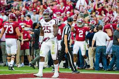 Texas A&M linebacker Tyrel Dodson (25) walks off the field as Alabama quarterback Jalen...