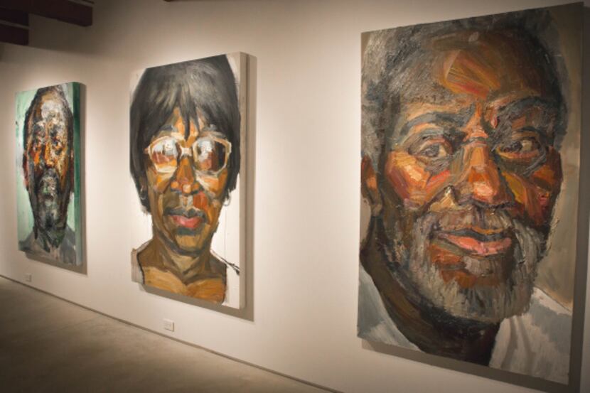 Large paintings by artist Sedrick Huckaby hang at the Valley House Gallery in Dallas,...
