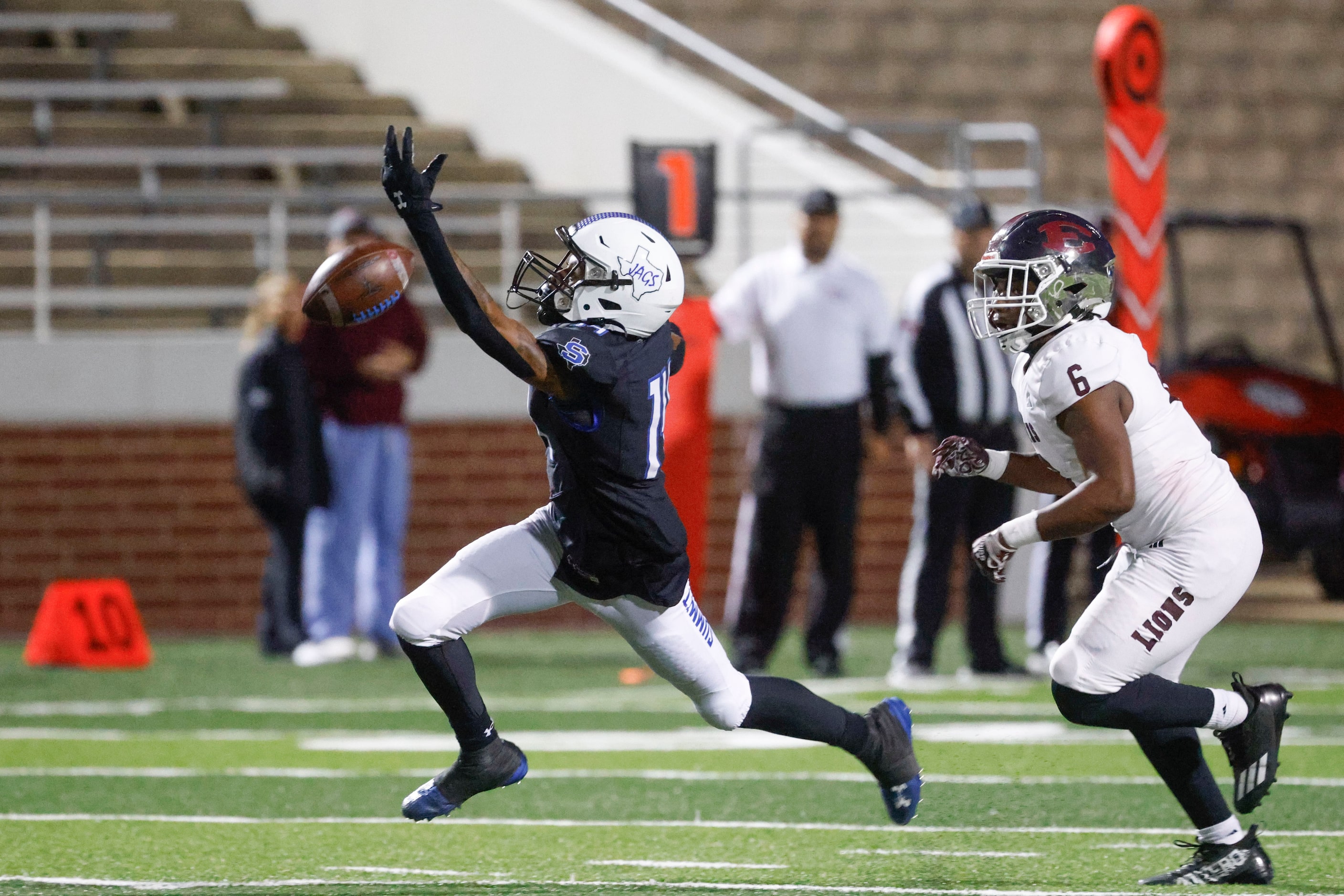 Mansfield Summit High’s Joshua Hephzibah-Evans (left) reaches for an incomplete pass past...