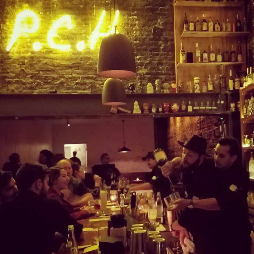 Herrera throws a little flair into his pour at Pacific Cocktail Haven, one of San...