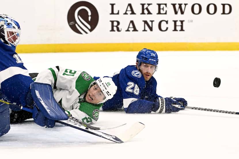 Dallas Stars left wing Jason Robertson (21) looks for a shot as Tampa Bay Lightning...