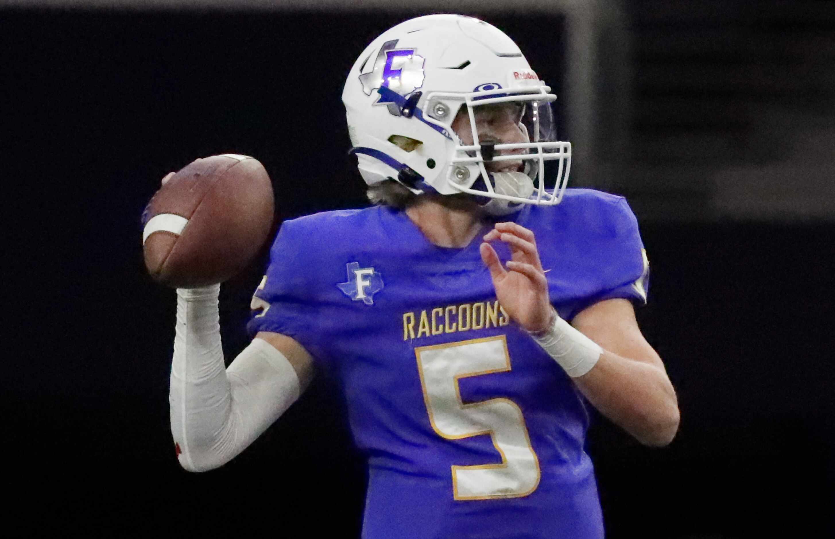 Frisco High School quarterback Cobyn Harbert (5) looks to pass during the first half as...