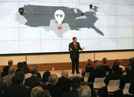 Toyota North America CEO Jim Lentz talks with the crowd at the grand opening of the new...