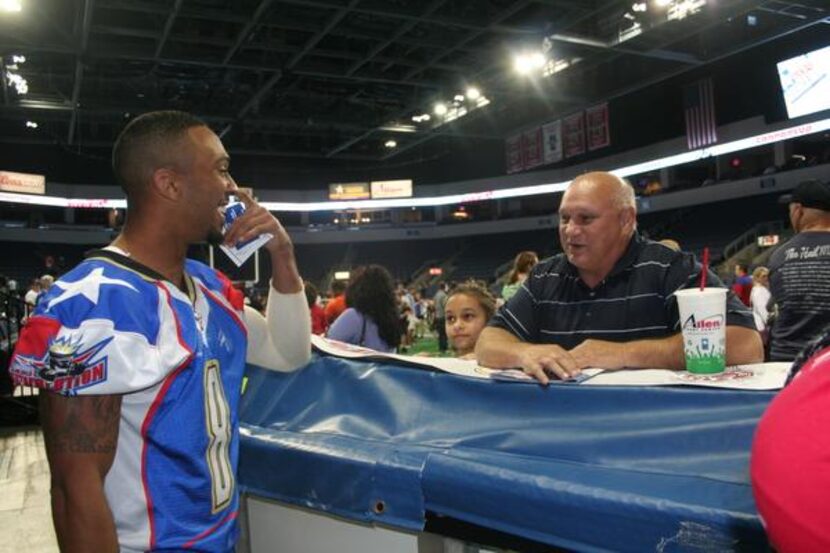 
Will Cole visits with a fan after the Texas Revolution’s loss to the Tri-Cities Fever on...