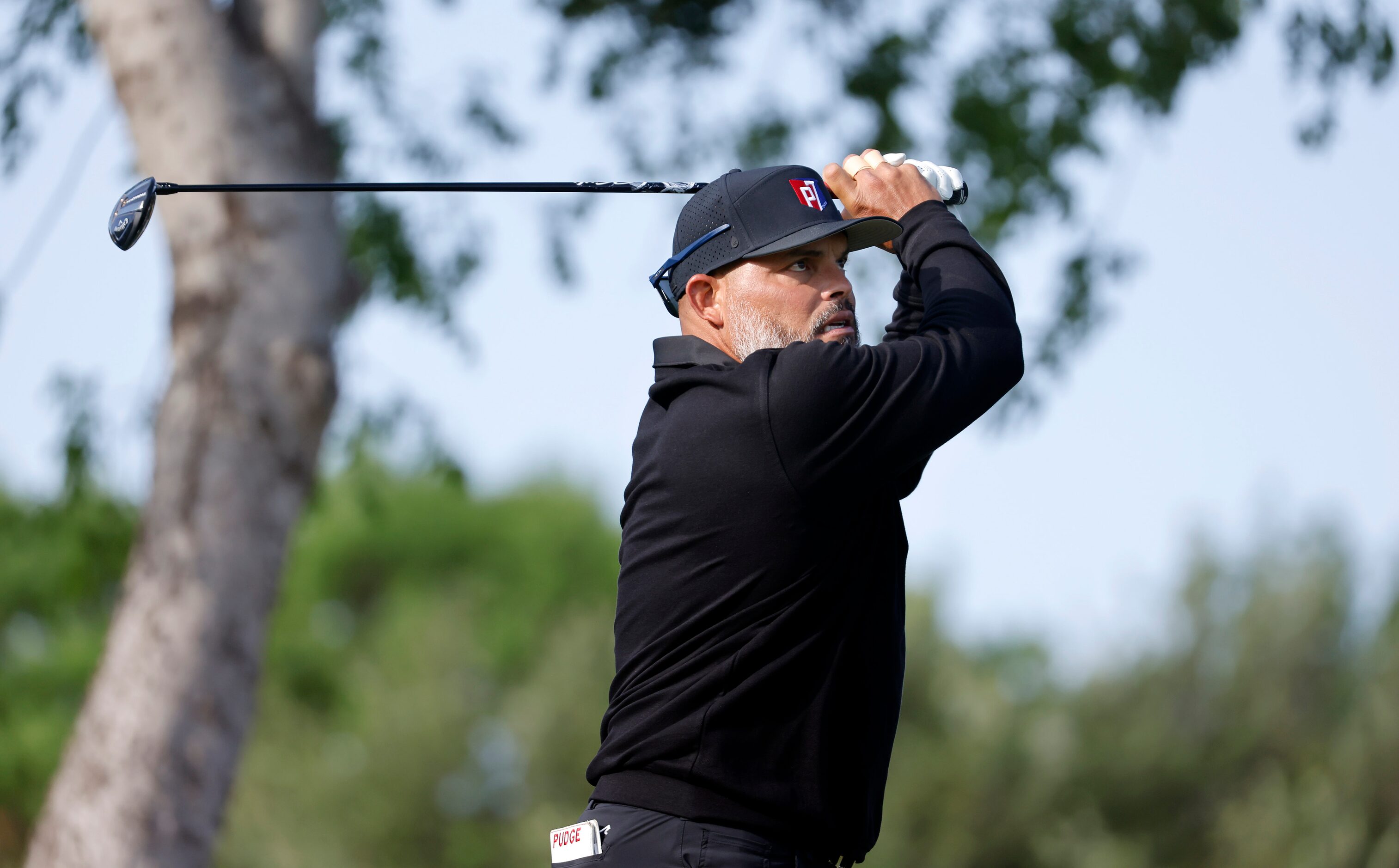 Former Texas Rangers Hall of Fame catcher Ivan ‘Pudge’ Rodriguez hits his drive on No. 15...