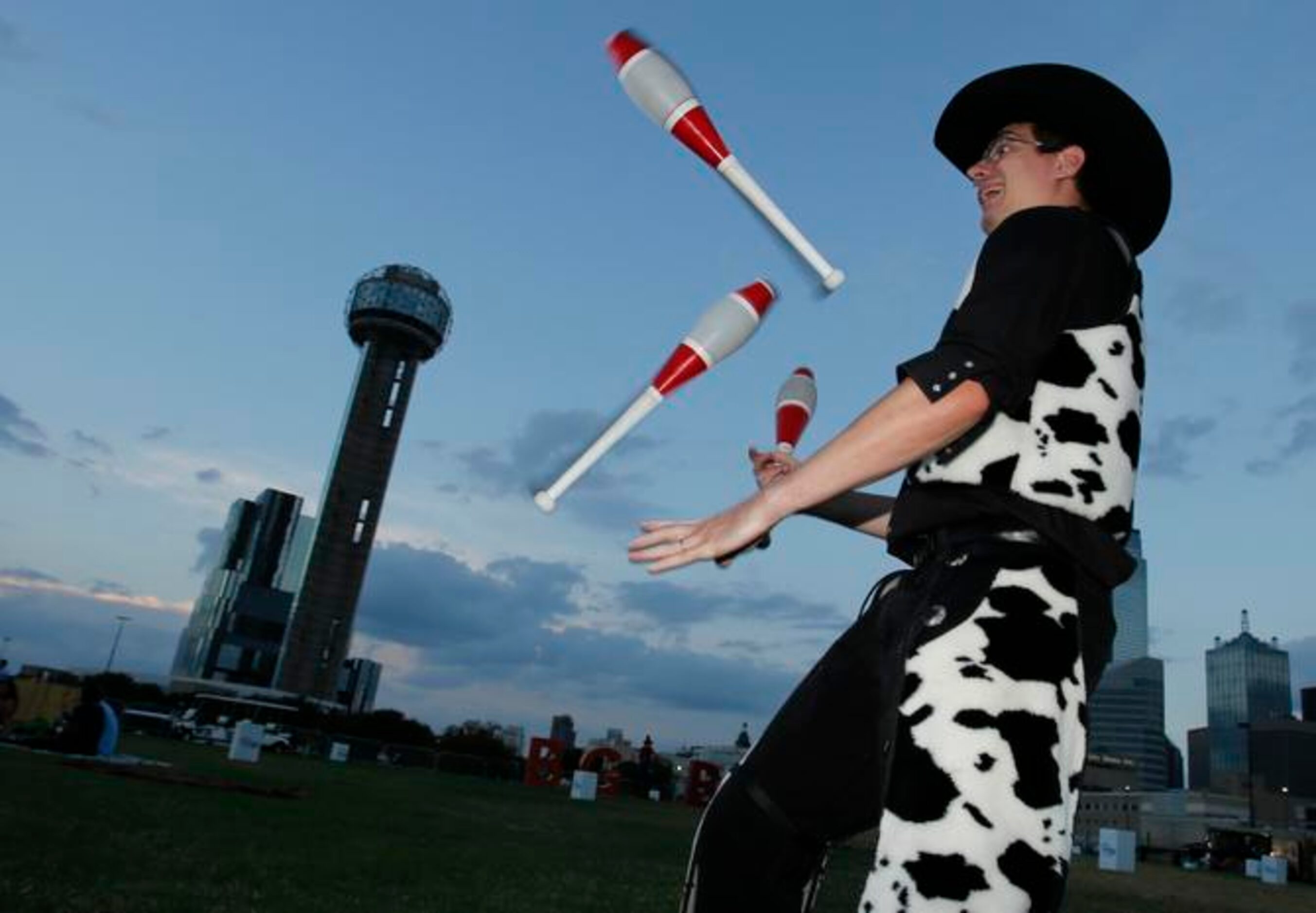 
David Slick of North Richland Hills entertains the crowd with some juggling as part of the...