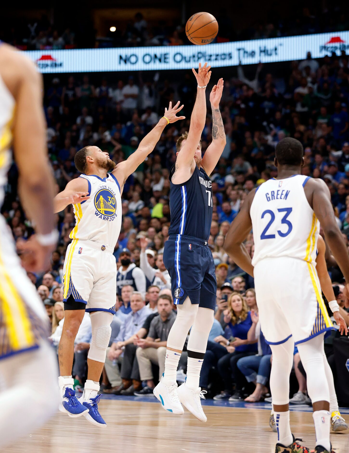 Dallas Mavericks guard Luka Doncic (77) puts up and makes a last second three-pointer...