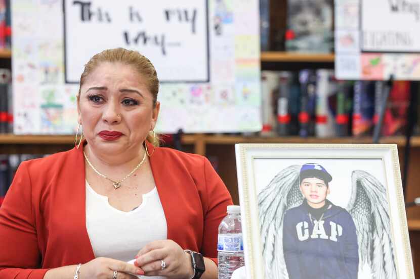Lilia Astudillo begins to cry as she speaks about her 14-year-old son (pictured right) José...