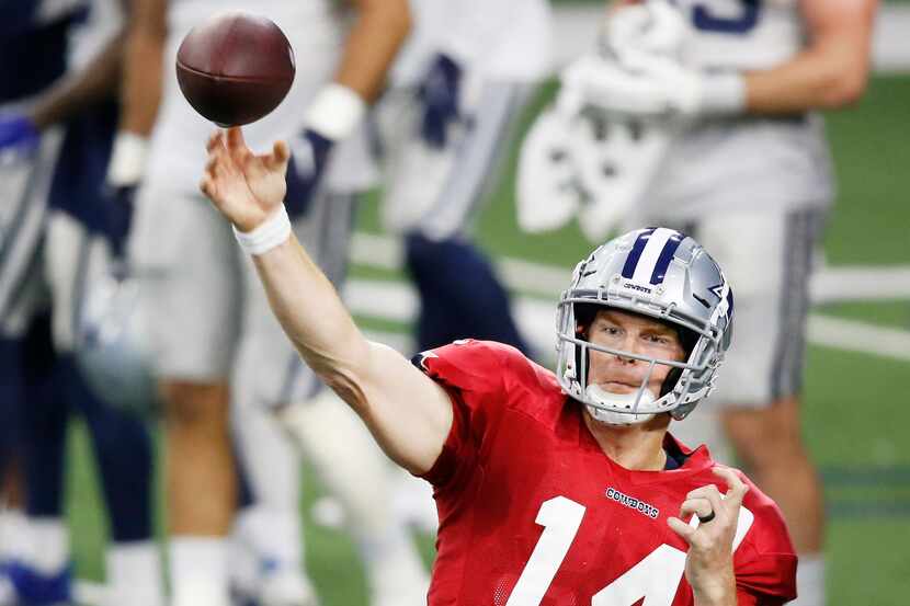 Dallas Cowboys quarterback Andy Dalton (14) attempts a pass in practice during training camp...