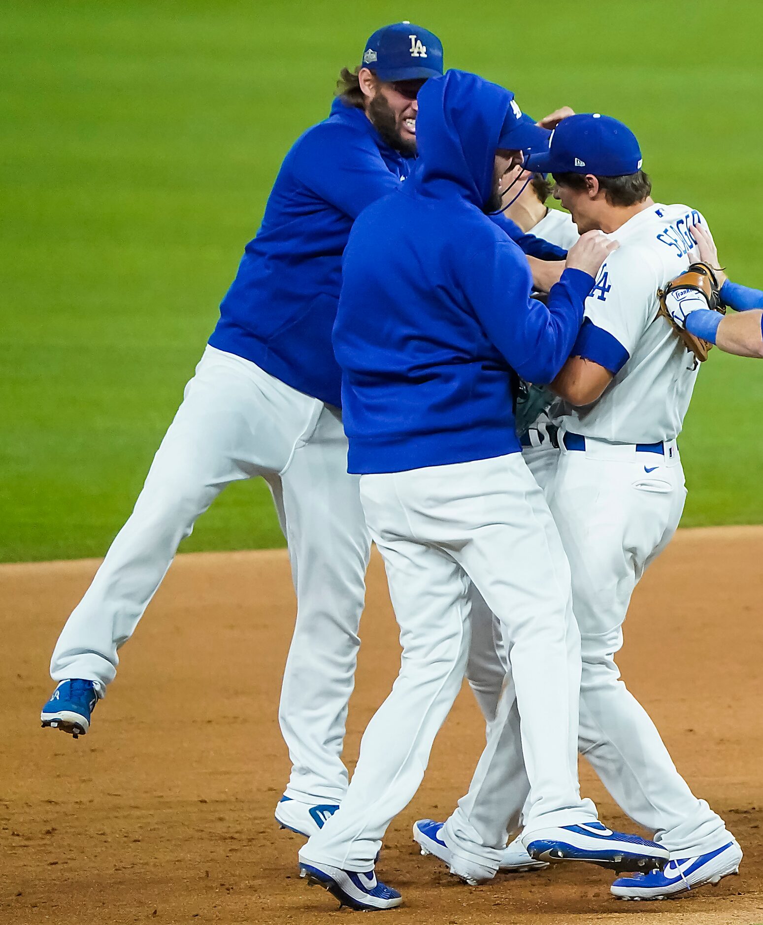 Los Angeles Dodgers shortstop Corey Seager (right) celebrates with teammates, including...