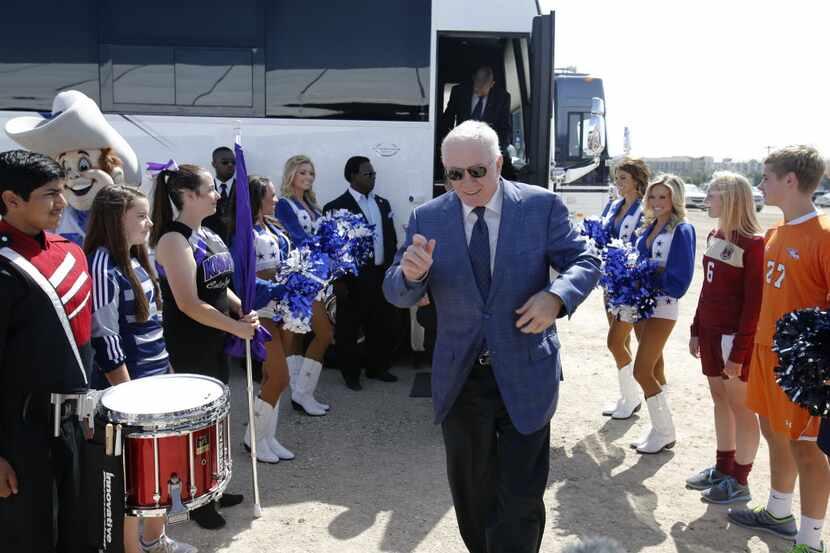 Dallas Cowboys owner and general manager Jerry Jones makes his way out of the bus in between...