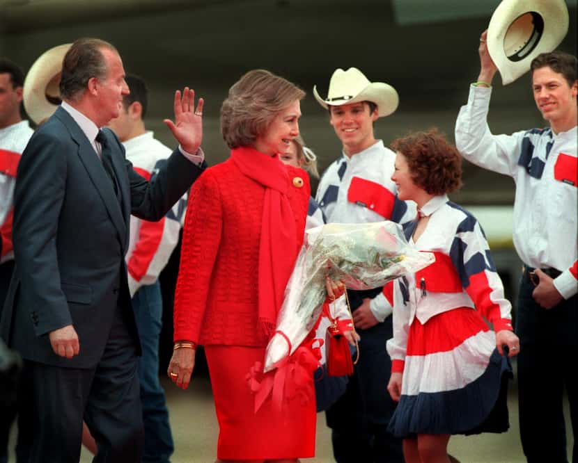 Spain's King Juan Carlos I and Queen Sofia are greeted upon their arrival in Dallas,...