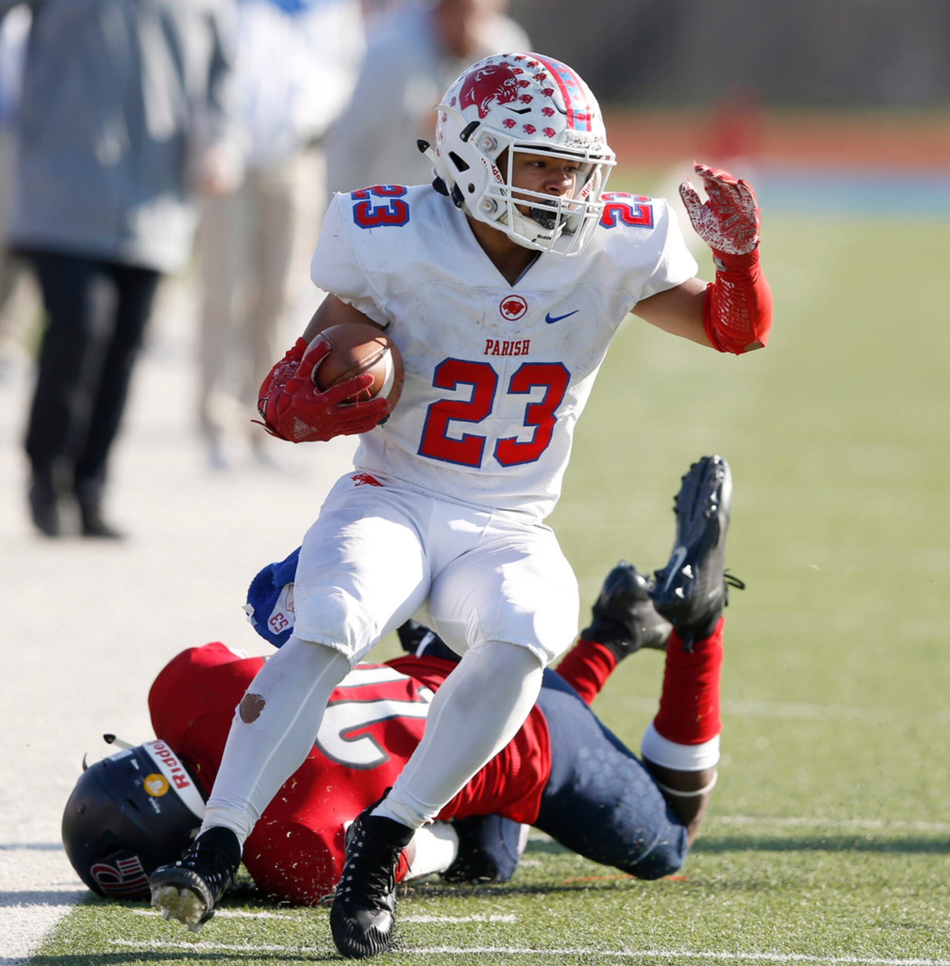 Parish Episcopal's Christian Benson (23) breaks away from  Plano John Paul II's Terrance...