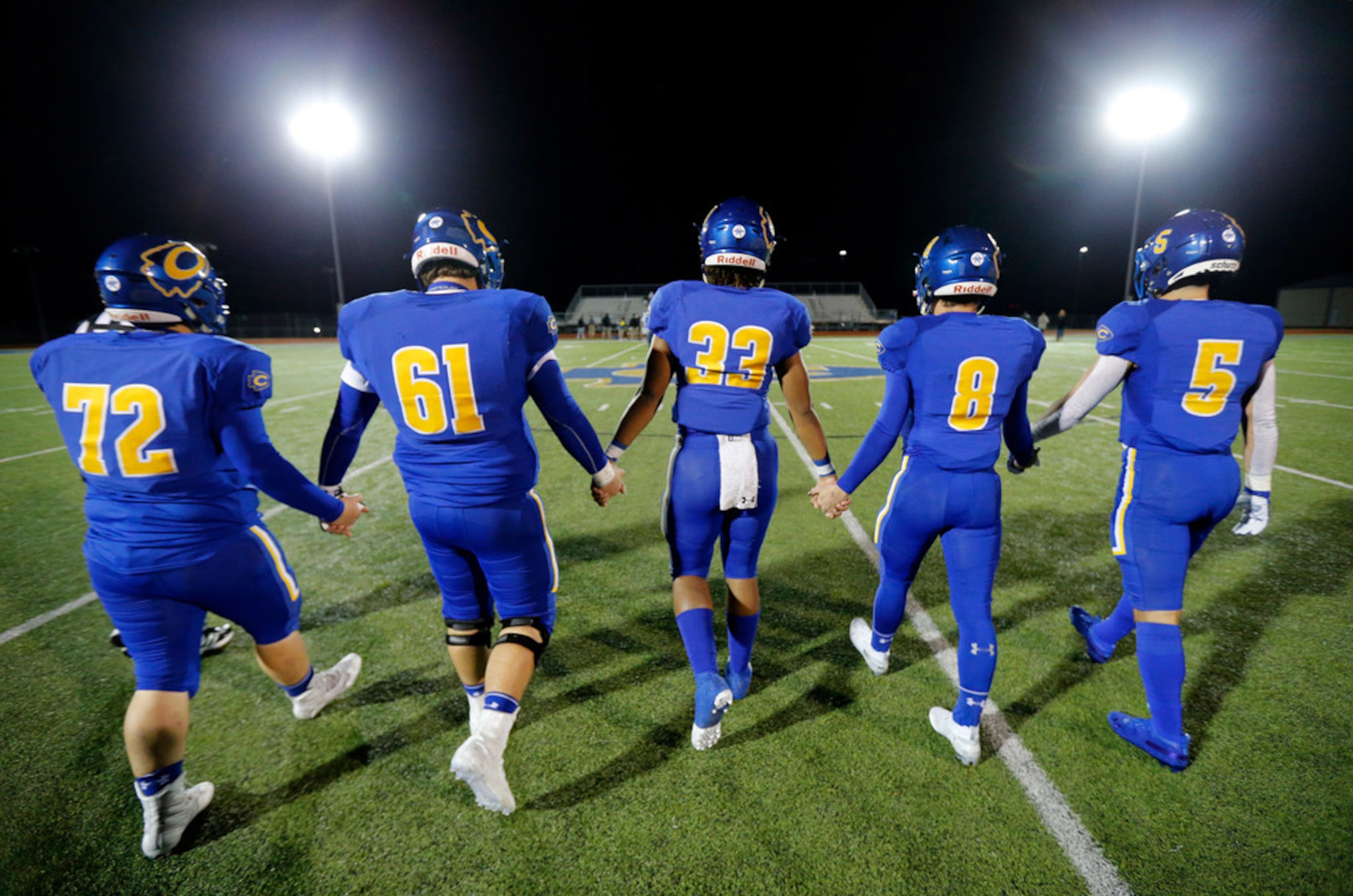 Community High football captains (from left) Eli Hartley, Kannon Marrow, Sean Outlaw, Parker...