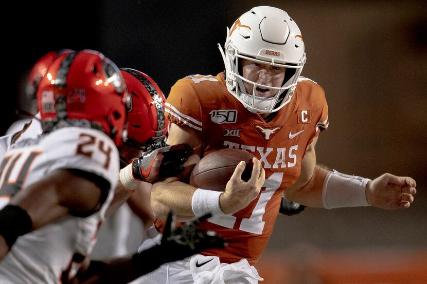 Texas quarterback Sam Ehlinger (11) runs the ball against Oklahoma State on Saturday, Sept....