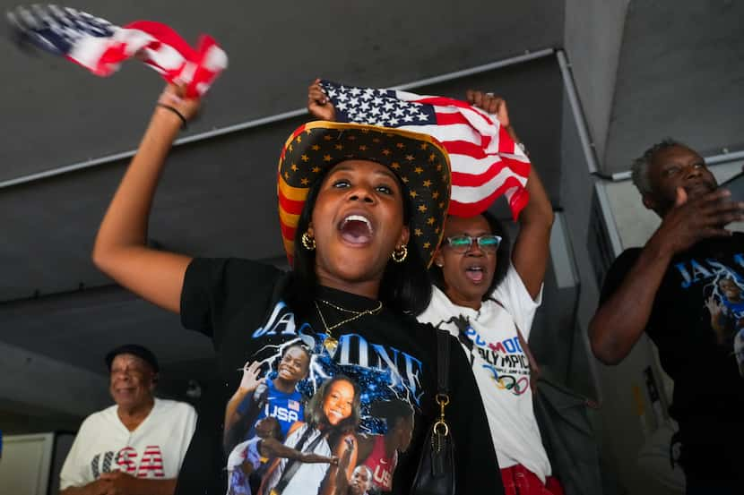 Maya Tillman and Kheri Tillman cheer the bronze medal finish of at Jasmine Moore of the...