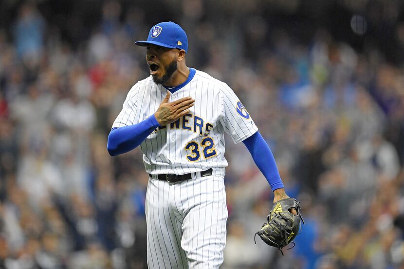 MILWAUKEE, WI - SEPTEMBER 28:  Jeremy Jeffress #32 of the Milwaukee Brewers reacts to a...