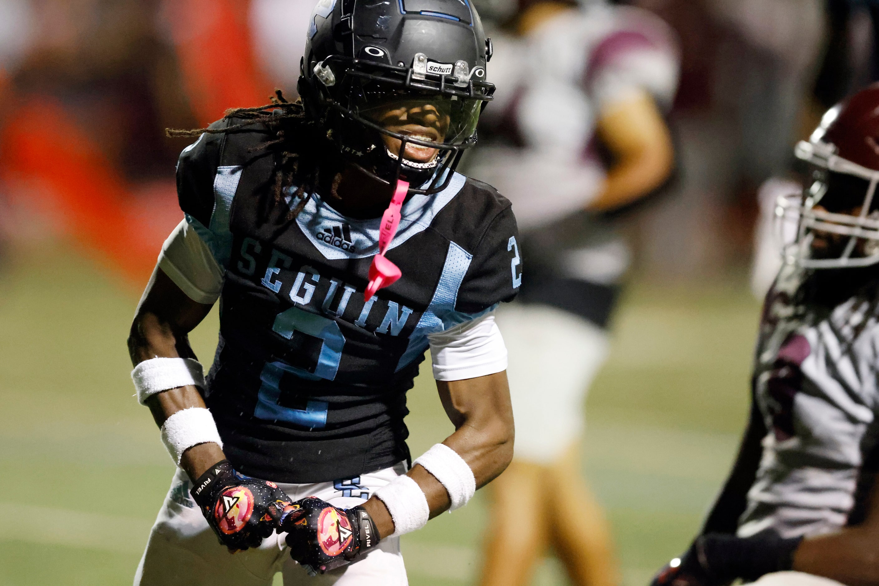 Arlington Seguin wide receiver G'mani Smith (2) celebrates after a touchdown during the...