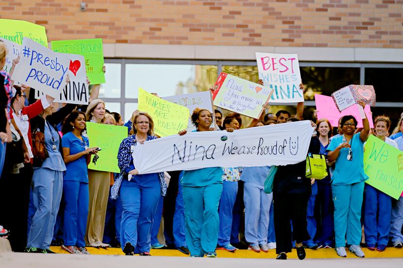 Nurses and staff members from Texas Health Presbyterian Hospital showed their support for...
