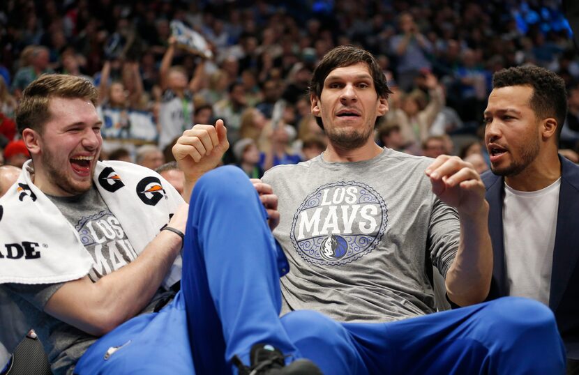 FILE - Mavericks center Boban Marjanovic (center) separates guards Luka Doncic (left) and...