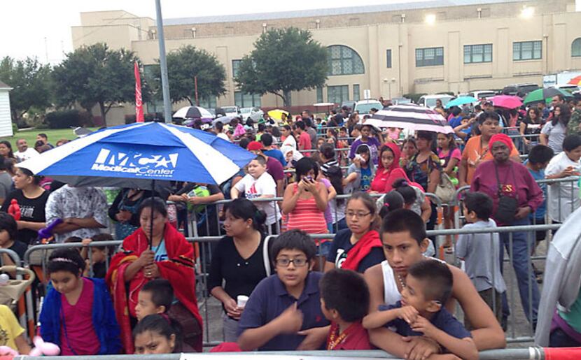 
Hundreds of school kids and their parents waited in the rain Friday morning at Fair Park...