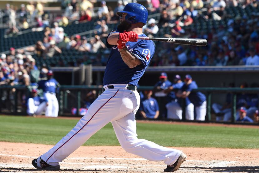 SURPRISE, AZ - MARCH 07:  Mike Napoli #5 of the Texas Rangers bats against the Colorado...