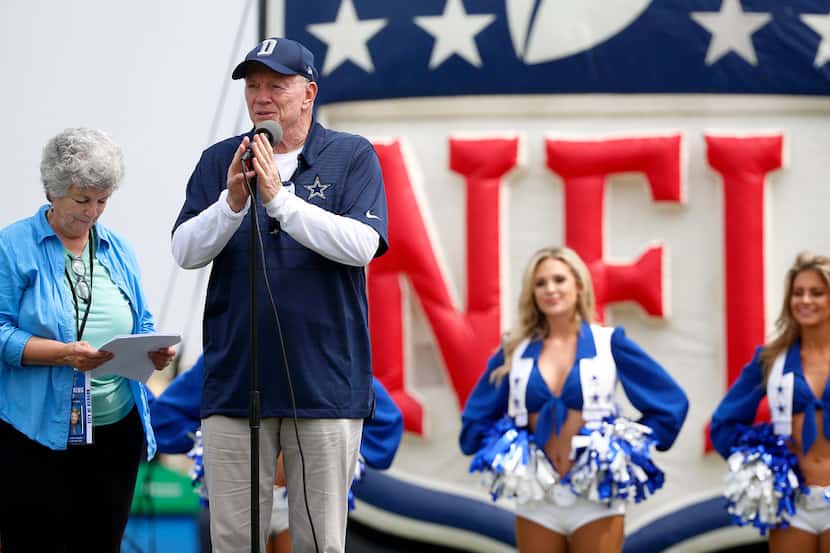 Dallas Cowboys owner Jerry Jones speaks next to Mayor Pro Tem Carmen Ramirez, left, during...