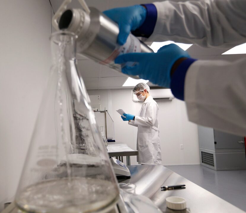 Product manager David Stermer (center) works on making terpenes as project manager Darius...