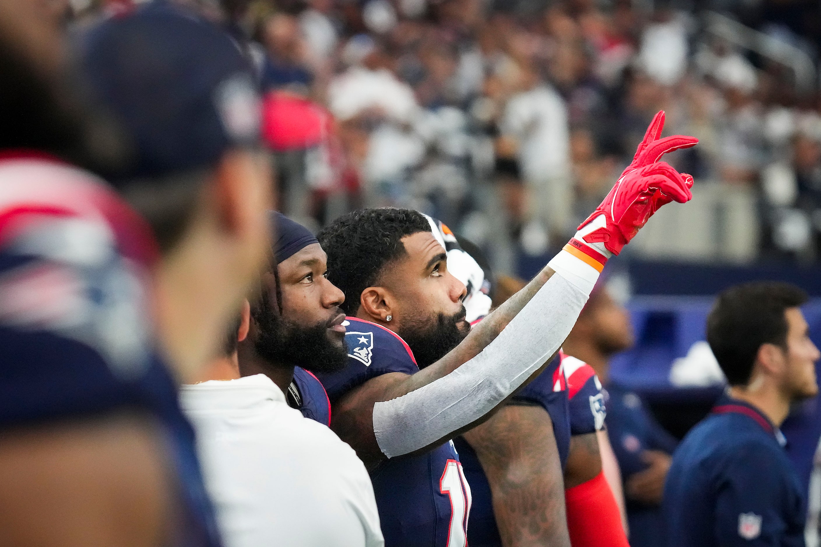 New England Patriots running back Ezekiel Elliott acknowledges the crowd after a video...