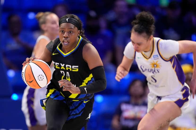 FILE -  Dallas Wings guard Arike Ogunbowale (24) comes away with a steal as Los Angeles...