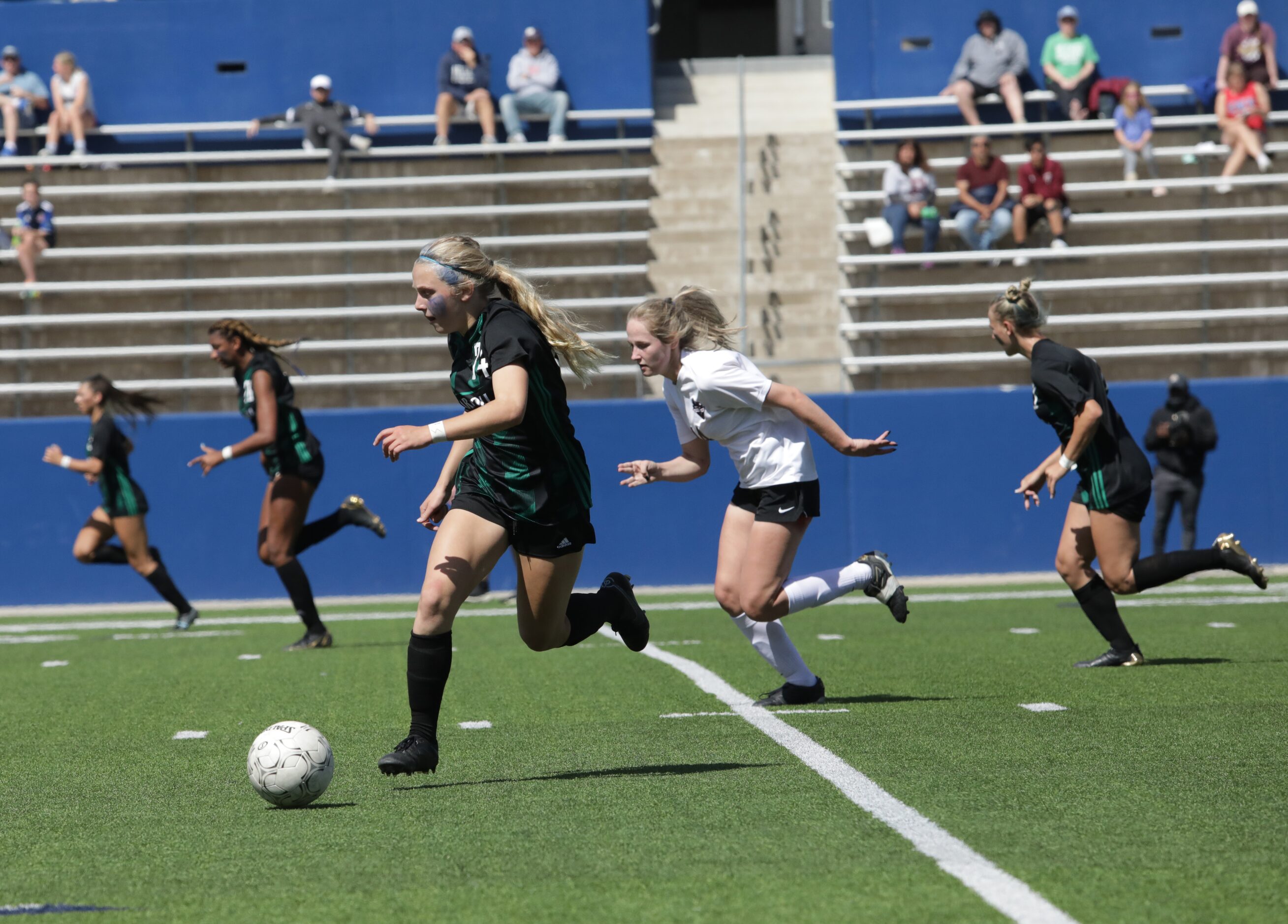 Southlake Carroll player #34, Hannah Jordan, moves the ball down field during a Class 6A...