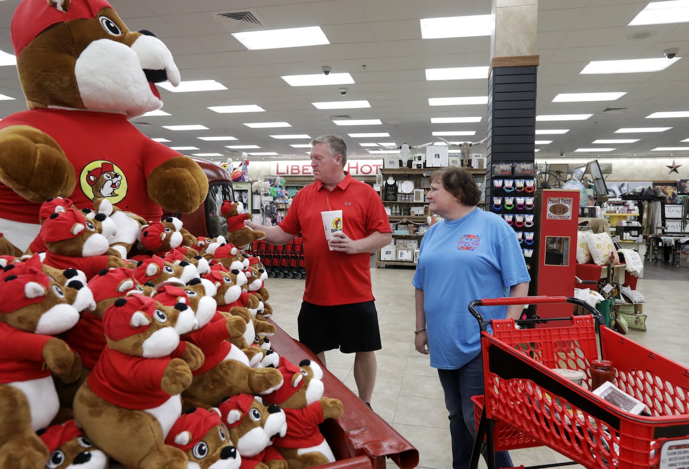 Randy Hayes, left, and Angie Hayes look at Buc-ee's beaver mascots while shoppinig at the...