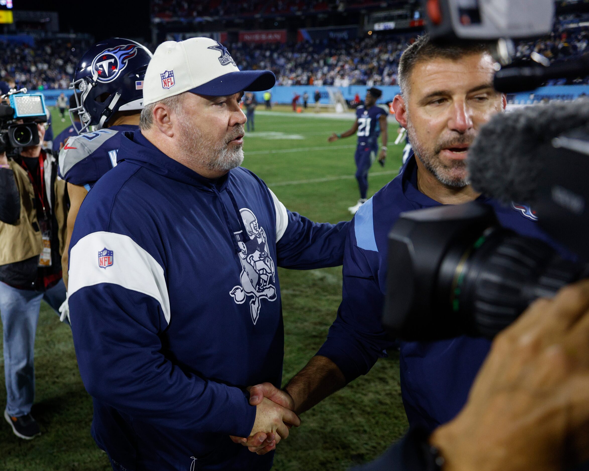 Dallas Cowboys head coach Mike McCarthy greets Tennessee Titans head coach Mike Vrabel after...