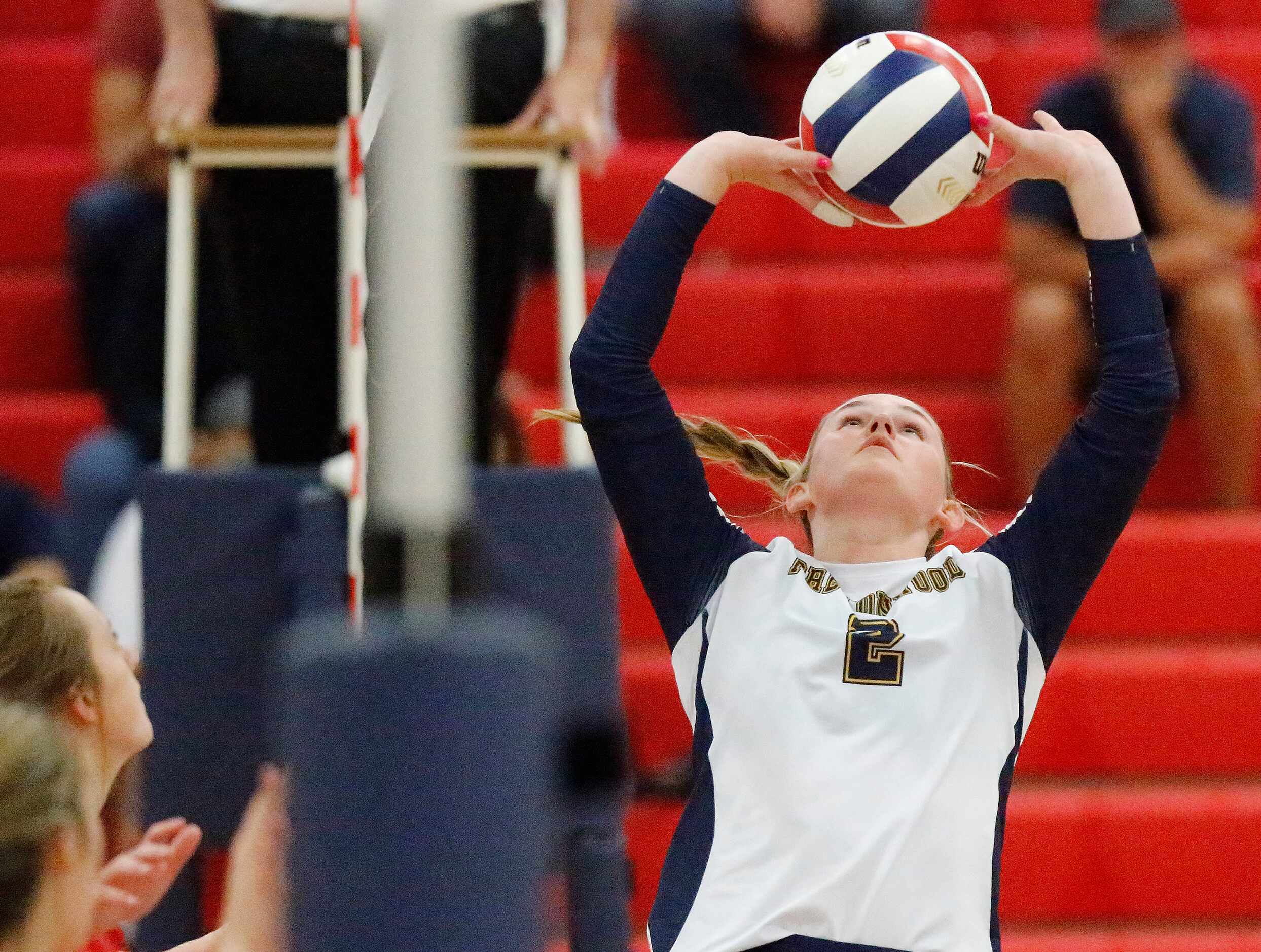 Prestonwood Christian Academy setter Camille Edwards (2) makes a set in game two as John...