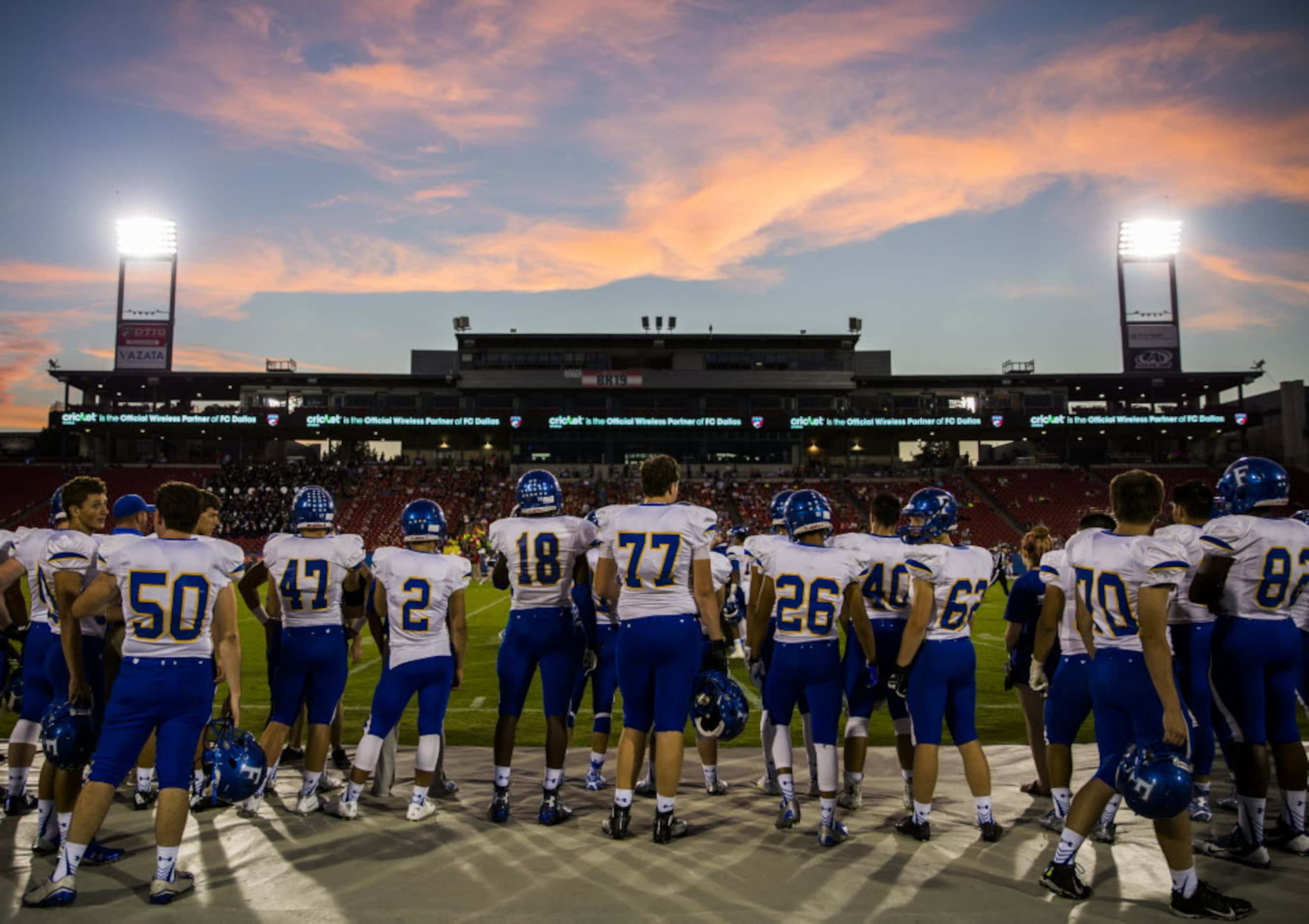 Frisco football players watch the first quarter of their game against Frisco Centennial from...