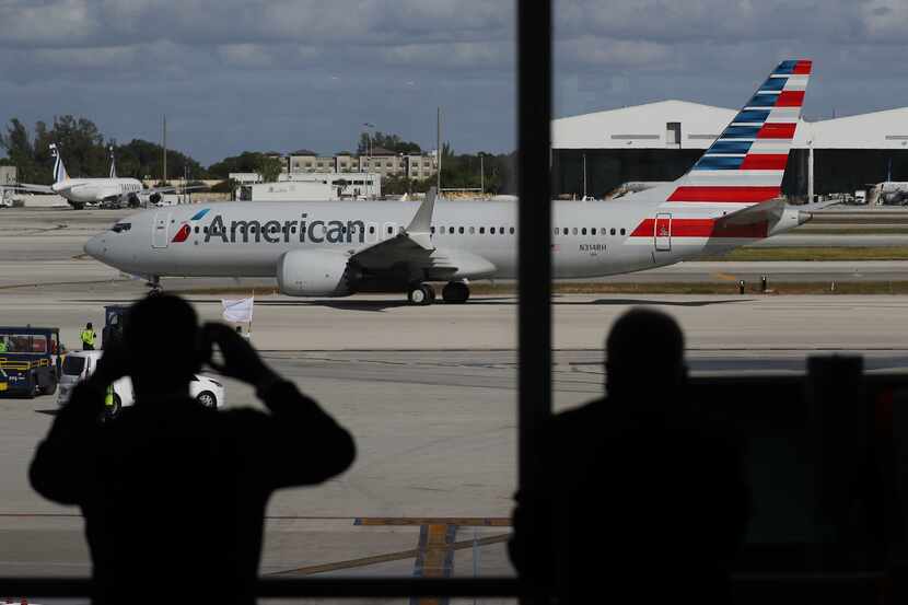 American Airlines flight 718, a Boeing 737 Max, pulls away from its gate at Miami...