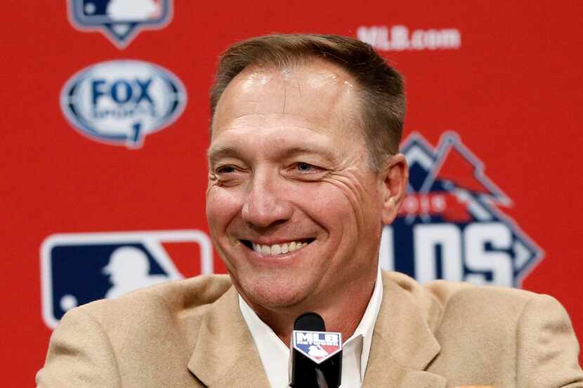 
Jeff Banister smiles as he listens to a question during a news conference announcing his...