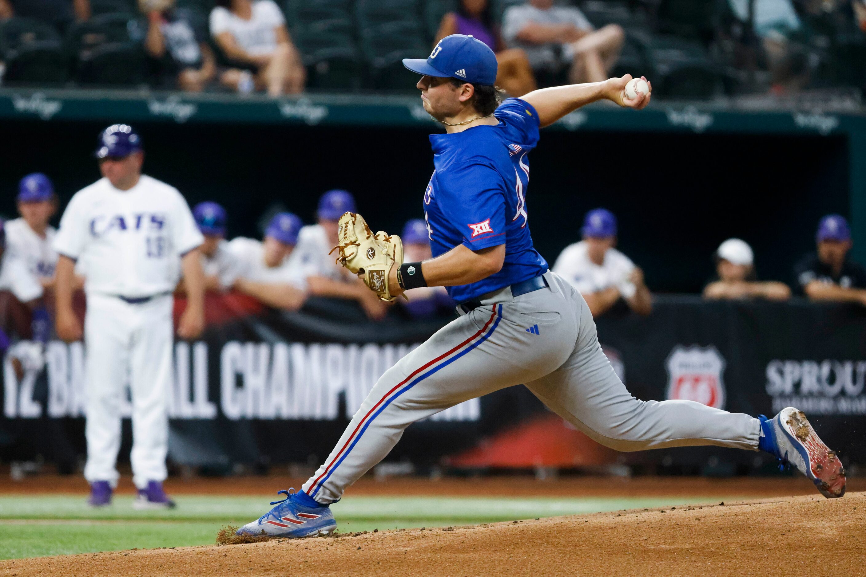 Kansas pitcher Sam Ireland throws during the first inning of a baseball game against Kansas...