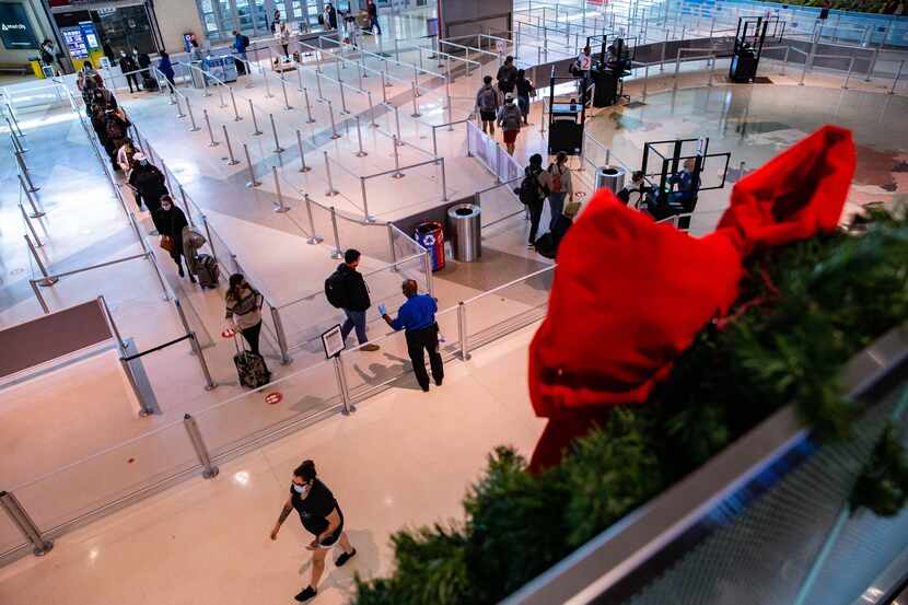 Travelers wait in the security line at Dallas Love Field Airport in Dallas on Wednesday,...