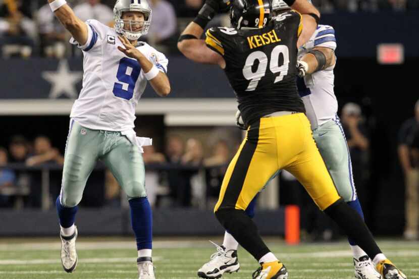 Dallas Cowboys quarterback Tony Romo (9) throws past Pittsburgh Steelers defensive end Brett...