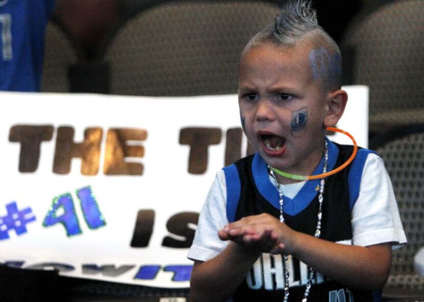 Four-year-old Austin States cheers during the watch party at the American Airlines Center in...