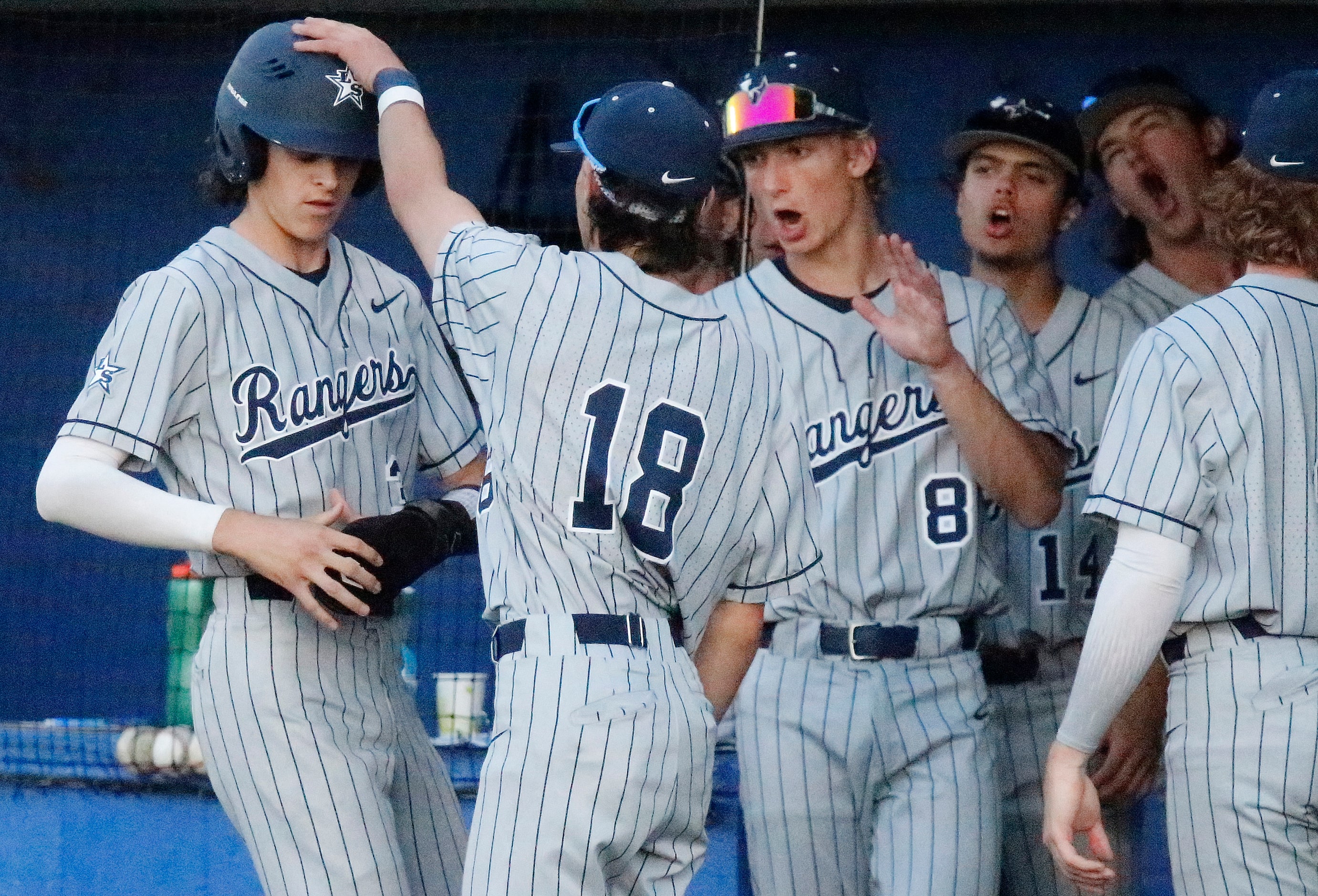 Lone Star High School infielder McCann Libby (3)  is congratulated by Lone Star High School...