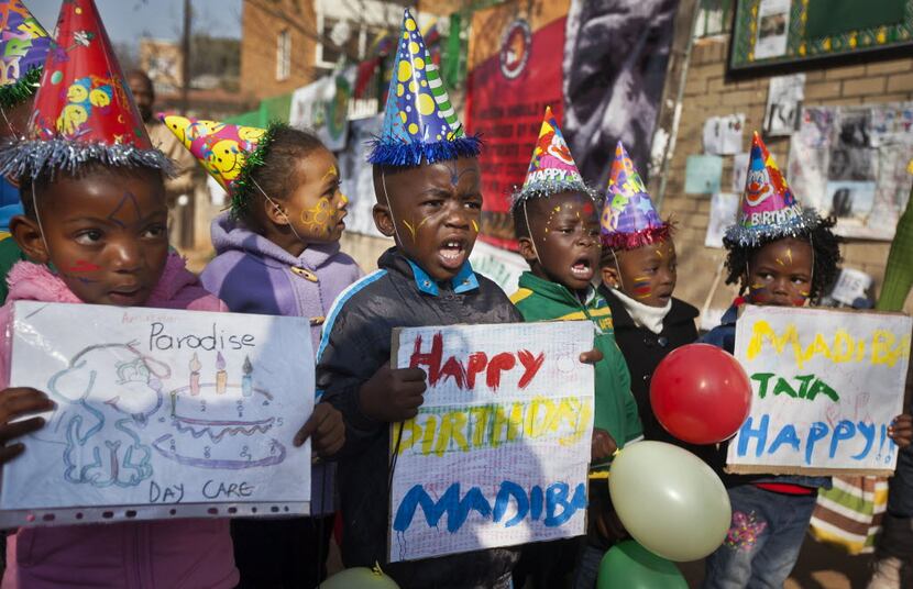 This July 18, 2013, file photo shows a group of kindergarten children singing Happy Birthday...