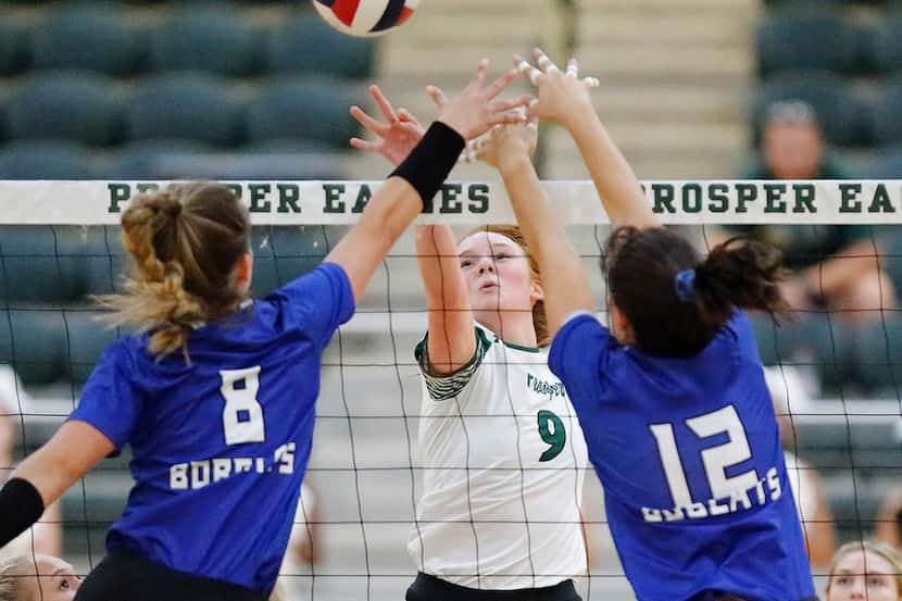 Trophy Club Byron Nelson's Paige Flickinger (8) and Payton Chamberlain (12) try to block a...