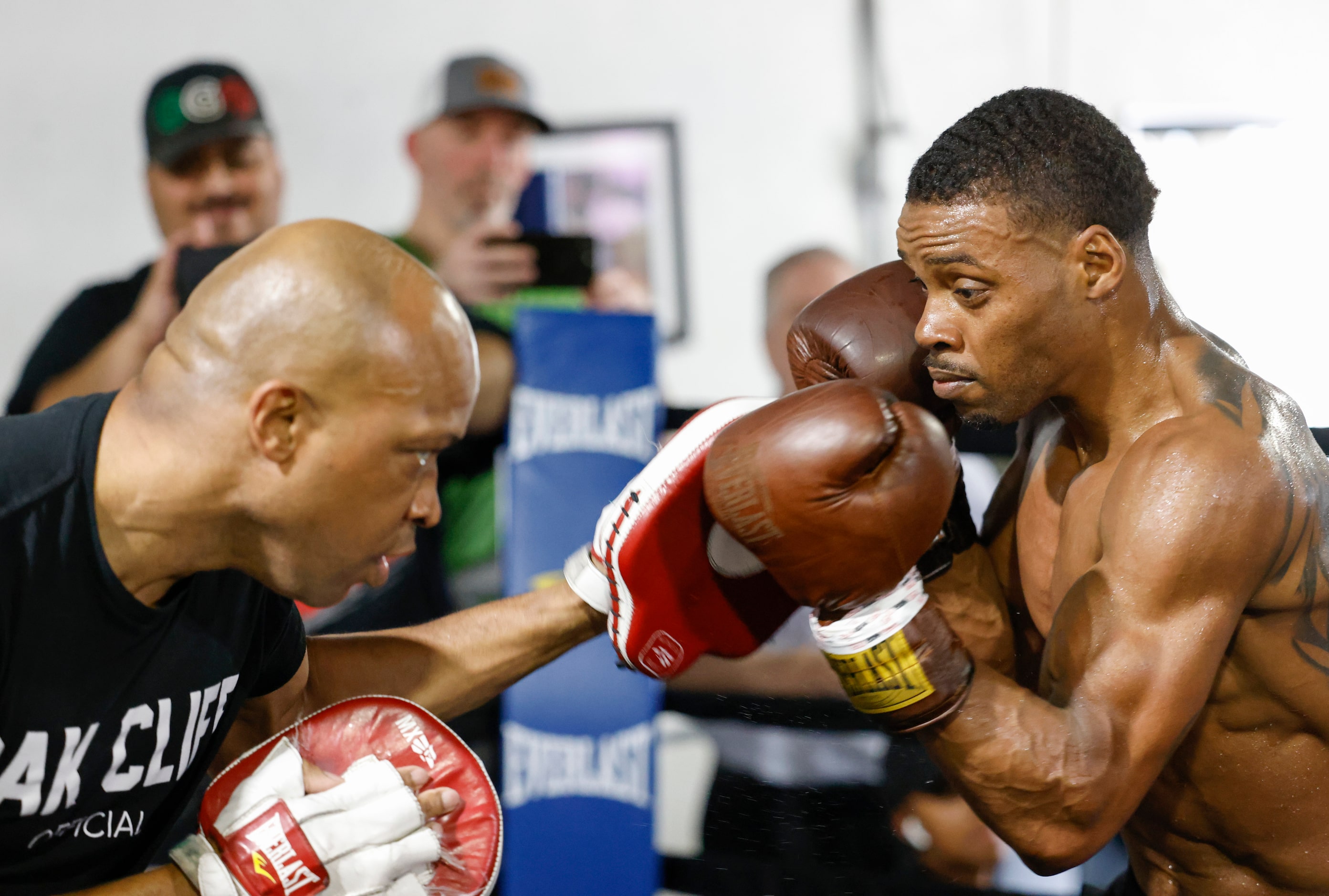 Errol Spence Jr. of Desoto, right, practices with his coach Derrick James during a media...