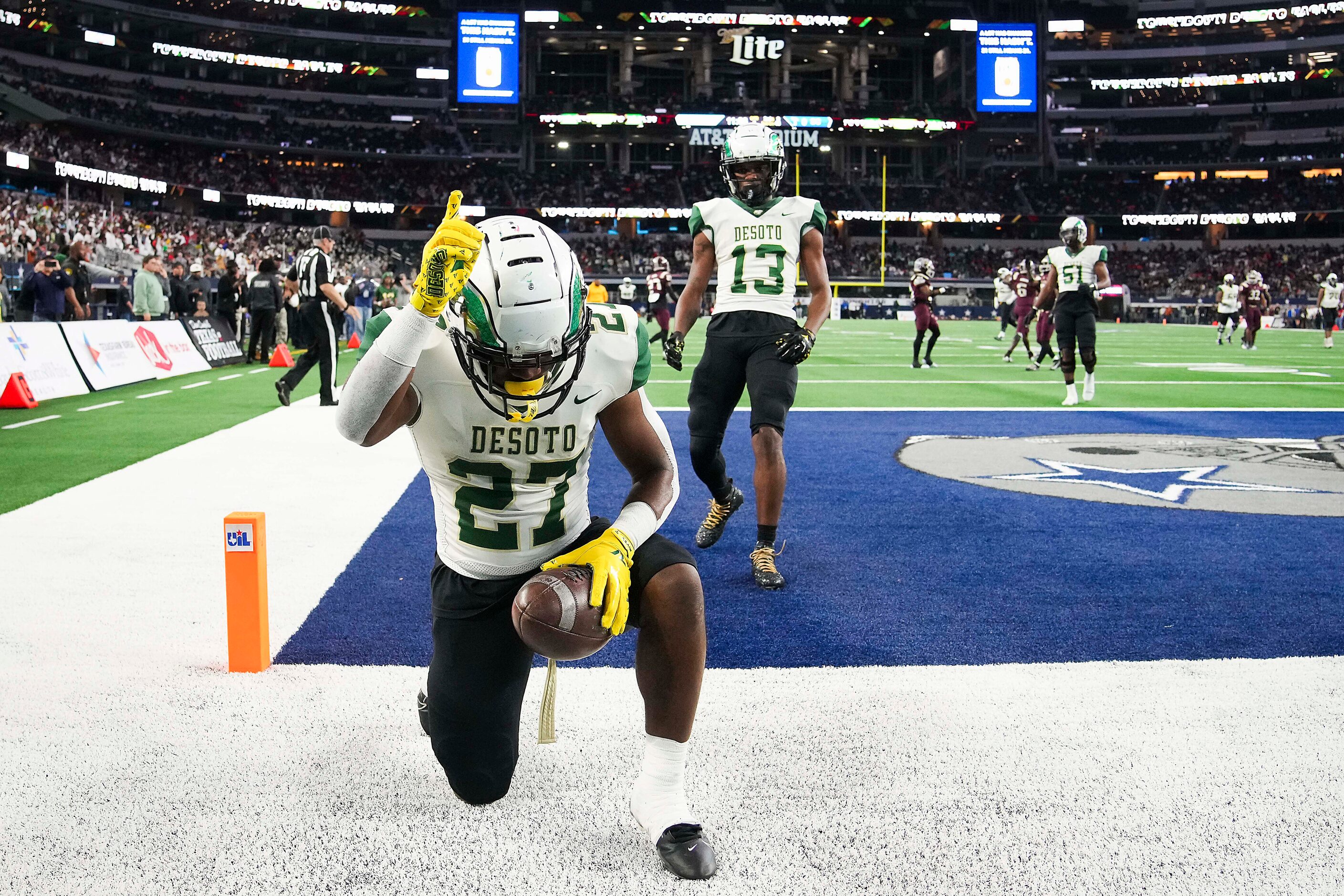 DeSoto running back Marvin Duffey (27) gives thanks after scoriong on a 55-yard touchdown...