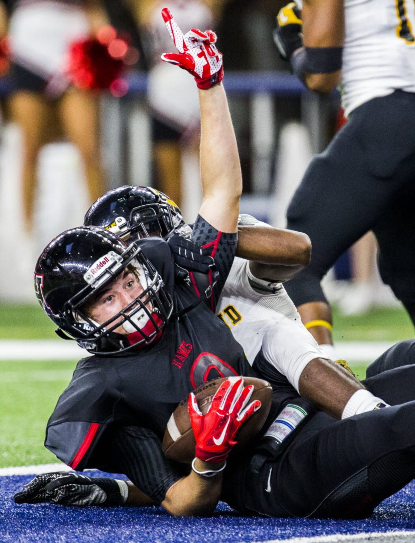 Rockwall-Heath's Jackson Sally (9) celebrates after catching a pass in the end zone for a...